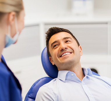 Man smiling in dental chair 