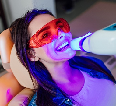Woman receiving teeth whitening
