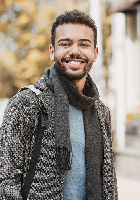 man smiling with dental crowns on Daniel Island