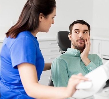 Man visiting dentist to prevent dental emergencies