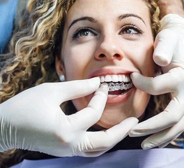 Smiling woman getting Invisalign in Daniel Island