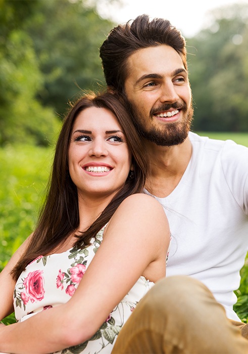 Man and woman with healthy smiles after preventive dentistry