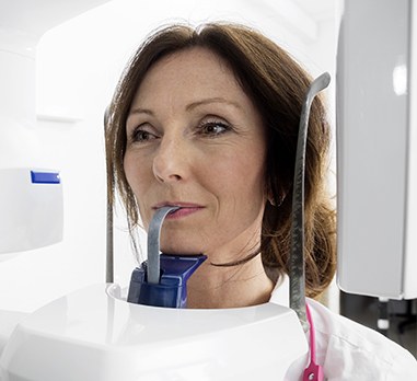 Woman receiving 3 D C T cone beam x-ray scans