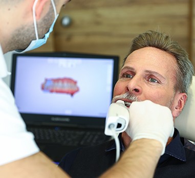 Dentist capturing digital impressions