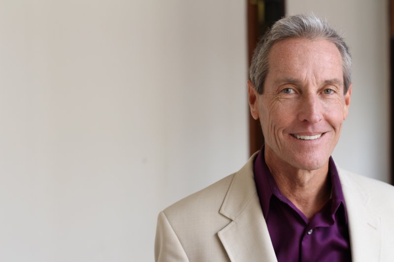 senior man smiling after Invisalign in Daniel Island