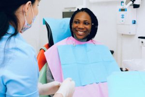 Woman in dental chair smiling